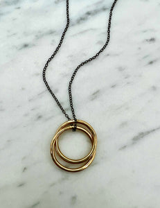 Interlocking Gold Circle Pendant on Black Silver Necklace